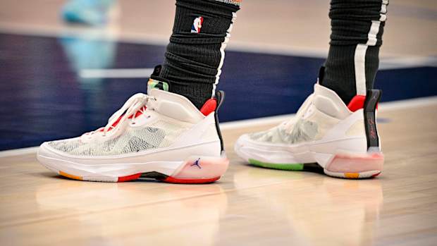 View of white and red Jordan shoes.
